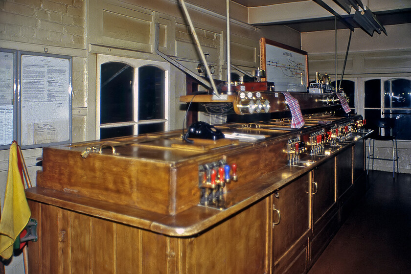 Interior of Salisbury West signal box 
 Having spent some time inside Salisbury East signal box Graham and I were also welcomed into the West box. The interior of this box was similar to its east cousin but not quite so grand with a lower-profiled control frame box as seen here. One subtle difference between the two was that in this box the signaller faces the lines when operating the equipment but in the East box the frame faced the other way with the signaller thus having his back to the running lines. 
 Keywords: Interior of Salisbury West signal box L&SWR London and Soth Western Railway