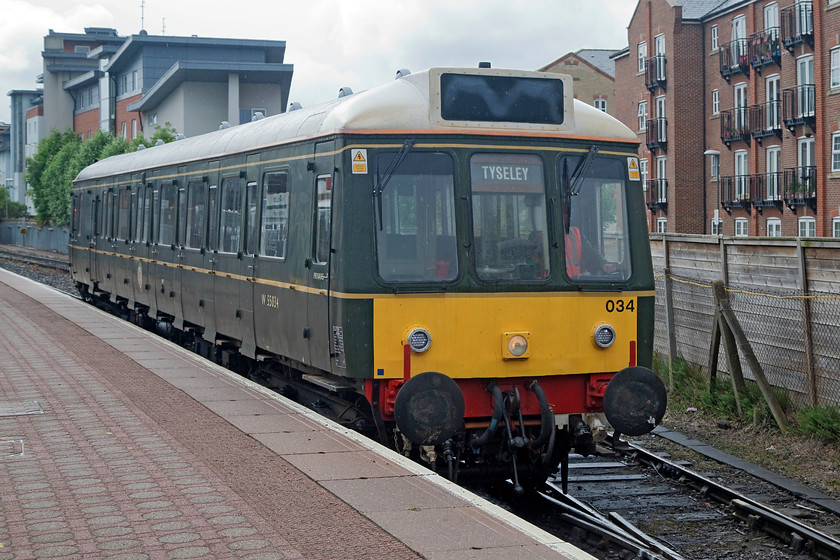 121034, ECS, Aylesbury station 
 Having completed its morning duties, 'bubble car' 121034 makes its way out of Aylesbury station as an ECS working the short distance to the depot. 
 Keywords: 121034 ECS Aylesbury station