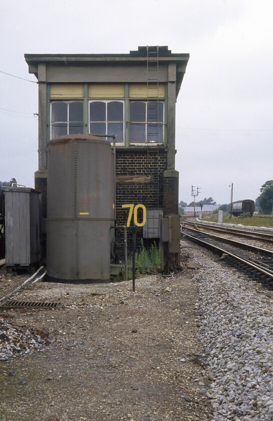 Salisbury West signal box (LSW, 1902) 
 Salisbury West signal box is seen from the end with the large air tank in the foreground. The box was built in 1902 for the L&SWR and in a break from tradition, it was pneumatically controlled rather than using the more usual mechanical levers. The box, and its twin Salisbury East, stayed in operation until just nine days after this photograph was taken having given seventy-nine years of service. 
 Keywords: Salisbury West signal box L&SWR London and South Western Railway