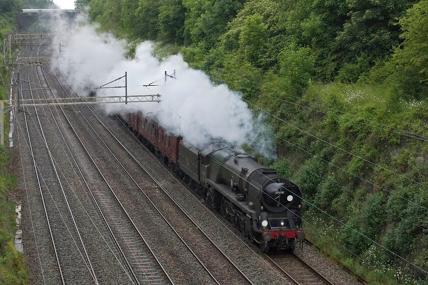 35018, 11.26 Carnforth Steamtown-Southall WCR ECS (5Z42, 16E), Hyde Road bridge 
 A Merchant Navy on the West Coast Mainline is not an everyday sight! 35018 'British India Line' is seen passing through Roade cutting working hard and with a good exhaust exacerbated by the cool and damp conditions. The Merchant Navy is leading the 11.26 Steamtown (Carnforth) to Southall empty stock move in preparations for a further move to Swanage for a special Southern event. Unbelievably, this is my first mainline photograph of 35018 on the mainline with my only other one taken forty-four years previously prior to its restoration, see... https://www.ontheupfast.com/p/21936chg/29397450204/x35018-awaiting-restoration-ropley 
 Keywords: 35018 11.26 Carnforth Steamtown-Southall WCR ECS 5Z42 Hyde Road bridge British India Line
Merchant Navy Class 4-6-2