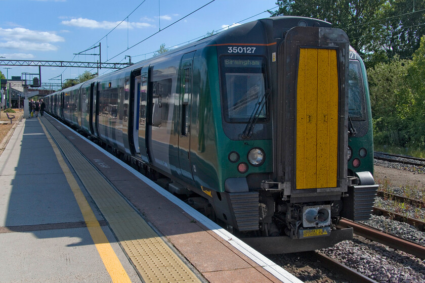 350127, LN 15.23 London Euston-Birmingham New Street (1Y47, 1E), Northampton station 
 The third and final train of what, on paper at least, would appear to be a pretty straightforward journey from Hemel Hempstead stands in Northampton station. However, due to cancellations and late running this journey was done in three steps. We travelled on 350127 from Milton Keynes working the 15.23 Euston to Birmingham New Street. It sits at Northampton for about fifteen minutes, as most services do, which must surely cause a good degree of frustration to many passengers! 
 Keywords: 350127 15.23 London Euston-Birmingham New Street 1Y47 Northampton station London Northwestern Desiro