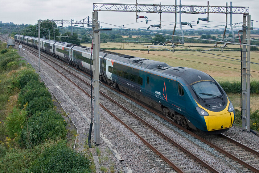 390006, VT 11.35 Manchester Piccadilly-London Euston (1A33, 3L), Blisworth 
 On a rather grey and dull early afternoon 390006 'Rethink Mental Illness' speeds southwards past Blisworth working the 1A33 11.35 Manchester to Euston service. 
 Keywords: 390006 11.35 Manchester Piccadilly-London Euston 1A33 Blisworth Rethink Mental Illness