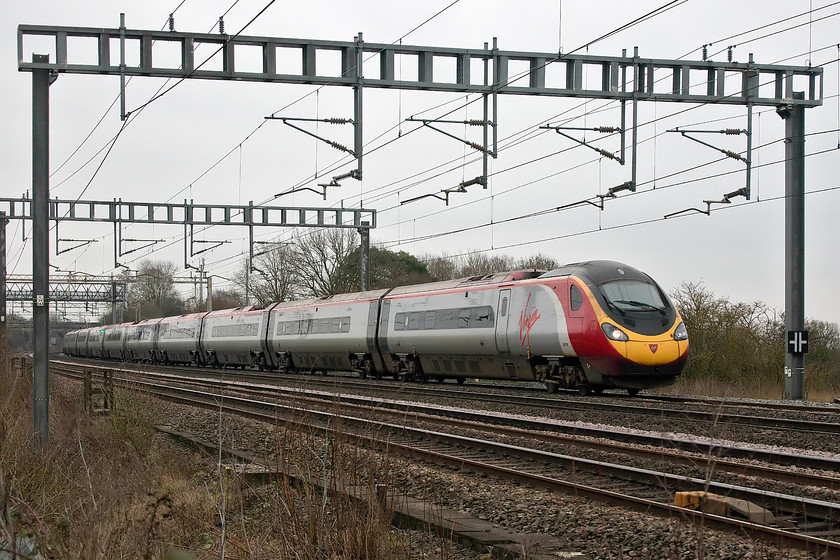 390128, VT 12.43 London Euston-Edinburgh (9S70, RT), Ashton Road bridge 
 390128 'City of Preston' is exactly sixty miles into its journey to Scotland. The 9S70 12.43 Euston to Edinburgh passes the south Northamptonshire countryside on a particularly gloomy and cold January day. 
 Keywords: 390128 12.43 London Euston-Edinburgh 9S70 Ashton Road bridge