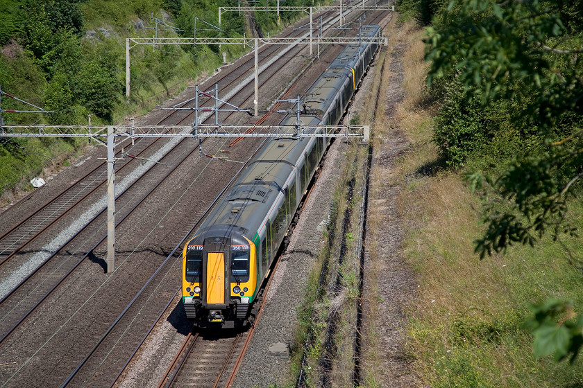 350119 & 350244, LM 09.54 Birmingham New Street-London Euston (2Y64, 6L), Roade Cutting 
 390119 and 350244 form the 09.54 Birmingham New Street to Euston and are seen working through a sunny Roade Cutting. 
 Keywords: 350119 350244 2Y64 Roade Cutting