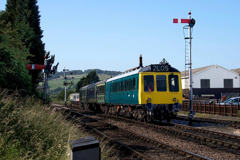 W51360, W59510 & W51363, ECS, Toddington station 
 With the down platform at Toddington station having been cleared of the stock from the previous day's services, a three-car class 117 DMU arrives from the yard in order to operate the first train of the new day. This particular set, with W51360 leading, is wearing a mixture of BR blue and Britsih Railways green livery. The class 117s were built by Pressed Steel for use on Western Region largely in and out of Paddington. The last examples were withdrawn from service in the capital in 1992 being replaced by the Turbos. 
 Keywords: W51360 W59510 W51363 Toddington station