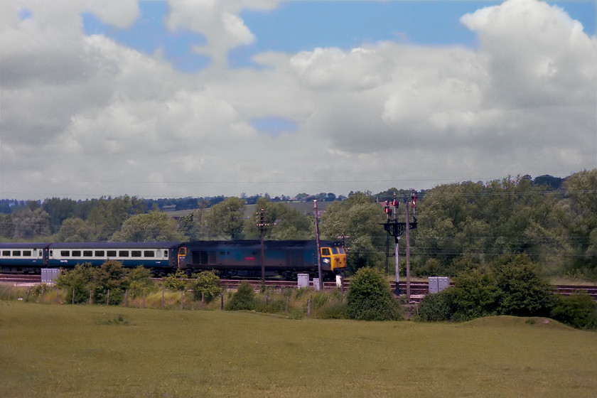 50047, unidentified up working, Hungerford SU345682 
 50047 had only been named 'Swiftsure' three weeks prior to this picture being taken at Hungerford Common to the east of the town of the same name. It was nice to see it working an unidentified up service in a burst of summer sunshine past the bracket signal that has been pulled-off for a down train. 
 Keywords: 50047 up working Hungerford SU345682