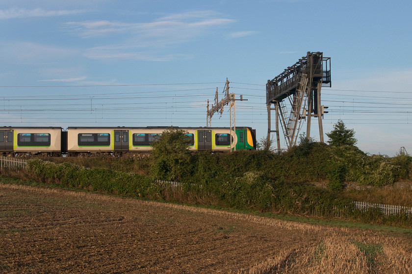 350236, LN 06.45 Bletchley CS-Northampton ECS (5Y52), between Roade & Ashton SP764506 
 Whilst walking back from photographing the sleeper I took a number if side-on pictures in the lovely morning sun. With the freshly ploughed rape field in the foreground, 350236 passes between Roade and Ashton forming the 06.45 Bletchley carriage sidings to Northampton ECS working. This particular class 350 still retains its London Midland livery with London Northwestern branding and is one of those likely to be removed from service soon as new units are introduced on this route. 
 Keywords: 350236 06.45 Bletchley CS-Northampton ECS 5Y52 between Roade & Ashton SP764506