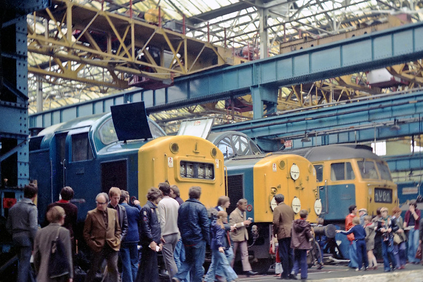 40163, 40113 & 47045, undergoing overhaul, Crewe Works 
 Even though the masses of people at open days can really get in the way of pictures, in this one they form a quite natural part of the composition. Undergoing overhaul at Crewe Works are 40163, 40113 and 47045. 40163 was withdrawn in 1982 and cut up at Vic Berry's yard in Leicester. 40113 met it's fate at Swindon following withdrawal in 1981. 47045 went though a couple of incarnations in its later life as 47568 and, finally, 47726 after having extended capacity fuel tanks fitted. It ended its life at EMR Kingsbury in April 2007.