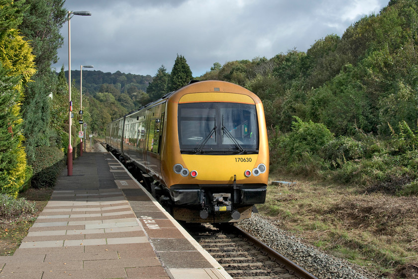 170630, LN 10.39 Hereford-Worcester Foregate Street (1M61, 1L), Colwell station 
 Class 170s now operate on the line from Hereford to Worcester and Birmingham with the older Class 150s having been ousted. Looking smart in its West Midlands Railway 'gold' livery, 170630 leaves Colwell station forming the 10.39 Hereford to Worcester Foregate Street. This service would normally continue north to Birmingham New Street but due to engineering works in the Droitwich area, no trains were going north of Worcester. 
 Keywords: 170630 10.39 Hereford-Worcester Foregate Street 1M61 Colwell station