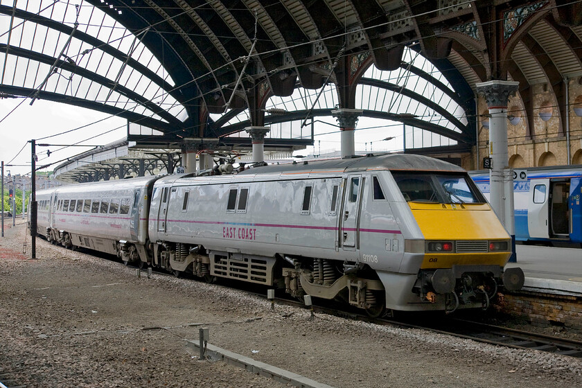 91108, GR 09.30 Edinburgh Waverley-London King's Cross (1E09), York station 
 The 09.30 Edinburgh to King's Cross 1E09 service gets away from York station. Whilst a rather dull DVT will be silently leading the train at the front, 91108 is at the rear making all the noise and providing the power, in this case nearly six and half thousand horsepower! 
 Keywords: 91108 09.30 Edinburgh Waverley-London King's Cross 1E09 York station InterCity Class 225