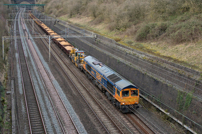 66731, 13.40 Bescot Up Engineers-Bletchley South Junction (7G50, 61L), Roade cutting 
 I had been tracking the slow and laboured progress of this infrastructure working on RTT for some time but it was losing time throughout its journey. 66731 'interhubGB' leads the 13.40 Bescot to Bletchley South Junction through Roade cutting. It was supposed to continue south past Bletchley to Wembley for the engine to change ends and then for the whole train to head back again. However, plans changed with it being terminated at Bletchley on its first pass but still being given a delay of just over an hour. 
 Keywords: 66731 13.40 Bescot Up Engineers-Bletchley South Junction 7G50 Roade cutting GBRF interhubGB