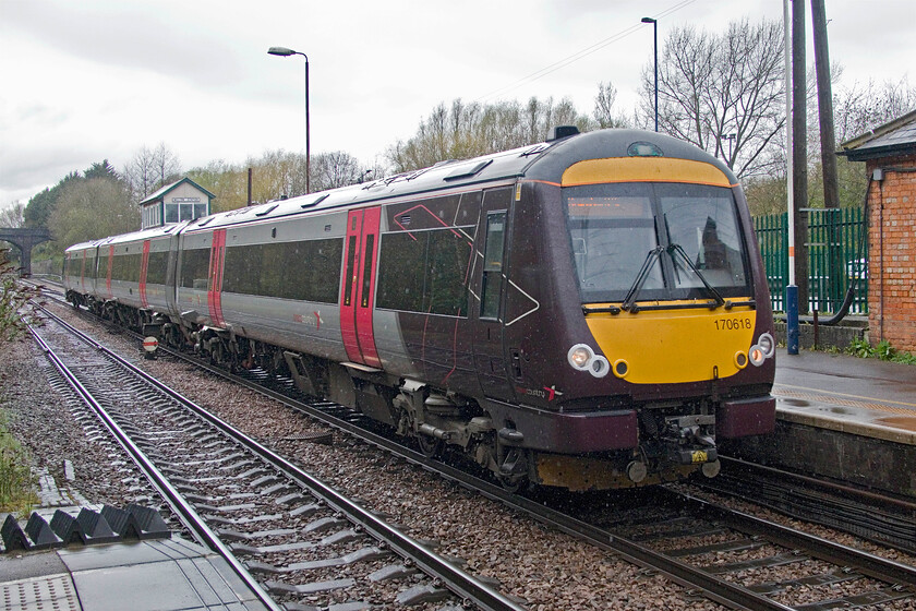 170618, XC 11.22 Birmingham New Street-Cambridge (1L38, 2L), Melton Mowbray station 
 CrossCountrys 170618 arrives at Melton Mowbray in the pouring rain working the 11.22 Birmingham New Street to Cambridge service. These services were busy on this particular day due to a cancellation and late running. The train we were waiting for at Melton was the next westward service following a cancellation of the service an hour earlier. 
 Keywords: 170618 11.22 Birmingham New Street-Cambridge 1L38 Melton Mowbray station CrossCountry XC Turbo