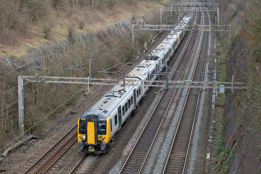 350102 & 350249, LN 15.15 London Euston-Crewe & Rugeley Trent Valley (1Y21 & 2H72, 16L & 13L), Roade cutting 
 The recent repainting of a number of Class 350s into this largely light grey livery is reminiscent of when they first arrived back in 2007. It is infinitely better than the awful metallic green paint scheme applied to some when West Midlands Railway took over the franchise in December 2017. 350102 and 350249 pass north through Roade cutting with the 15.15 Euston to Crewe and Rugeley Trent Valley with the service splitting at Birmingham New Street. 
 Keywords: 350102 350249 15.15 London Euston-Crewe & Rugeley Trent Valley 1Y21 2H72 Roade cutting Desiro London North Western Railway