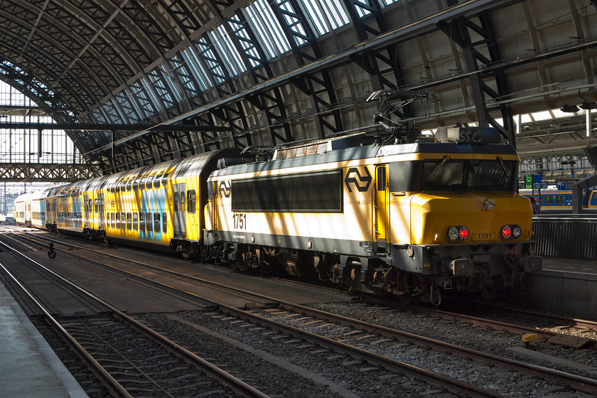 1751, 17.36 Amsterdam Central-Enkhuizen (IC 4556), Amsterdam Central station 
 Bearing a striking resemblance to French class BB 7200, on which they were based, these Alstom built class 1700s have been a pretty reliable set of locomotives since their introduction in the early 1990s. 1751 waits to propel the 17.36 to Enkhuizen away from Amsterdam Central station. 
 Keywords: 1751 17.36 Amsterdam Central-Enkhuizen IC 4556 Amsterdam Central station