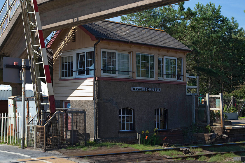 Ferryside signal box (GWR, 1880s) 
 Andy and I arrived at Ferryside, located on the Towy estuary, in late afternoon and what delightful place it was! To rest our weary selves, we bought ice creams and, after removing our shoes, had a relaxing paddle in the sea. This image shows the GW Type 3 signal box opened sometime in the 1880s. Even though this view does not show it, the box is in a superb location with the beach and the estuary just behind it. It is such a shame that the the ghastly 1960s style footbridge dominates any view of the box. The comedian Paul Merton visited Ferryside station in episode one of the three-part series Paul Merton's Secret Stations. 
 Keywords: Ferryside signal box