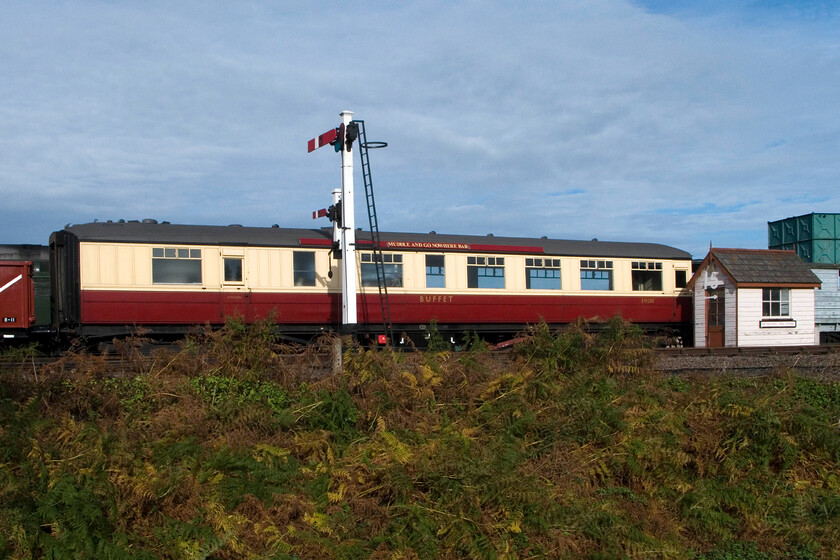 E9128, stabled, Weybourne Yard 
 E9128 was one of a pair of Gresley buffet cars that remained in use by BR until 1977 making them the only two of the very last pre-nationalisation coaches in service. E9128 was a regular vehicle on the famous Cambridge Buffet Express at this time, it also worked in the Harwich Boat Trains to and from Manchester and could also often be found on excursion work. It was secured by the M&GN Society for the princely sum of 4,500 + VAT which was an awful lot of money back in 1977! Today it sees regular use on the NNR but is due to enter the C & W workshop soon for a much-needed (apparently) overhaul. 
 Keywords: E9128, stabled, Weybourne Yard