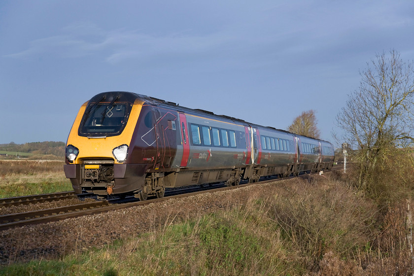 220027, XC 06.37 Nottingham-Southampton Central, (1O06), King's Sutton 
 After the bright and frosty start to the day the cloud is now beginning to roll in from the north-west creating a dramatic skyscape. CrossCountry's 220027 approaches King's Sutton working the 06.37 Nottingham to Southampton Central. 
 Keywords: 220027 06.37 Nottingham-Southampton Central 1O06 King's Sutton