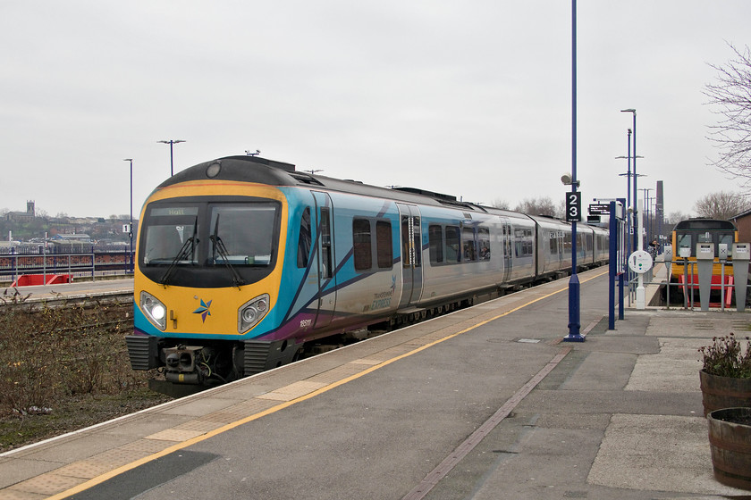 185111, TP 11.47 Manchester Piccadilly-Hull (1K17, 4L), Stalybridge station 
 185111 enters Stalybridge station with the TPE 11.47 Manchester Piccadilly to Hull working. Despite winning the Best Kept Large Station of the Year award last year the overgrown nature of the former trackbed between the platforms was a real mess. However, located behind me whilst taking this picture, was the popular and world renowned Station Buffet bar that has won numerous awards; unfortunately, they did not sell bacon baps so Andy did not visit it! 
 Keywords: 185111 11.47 Manchester Piccadilly-Hull 1K17 Stalybridge station