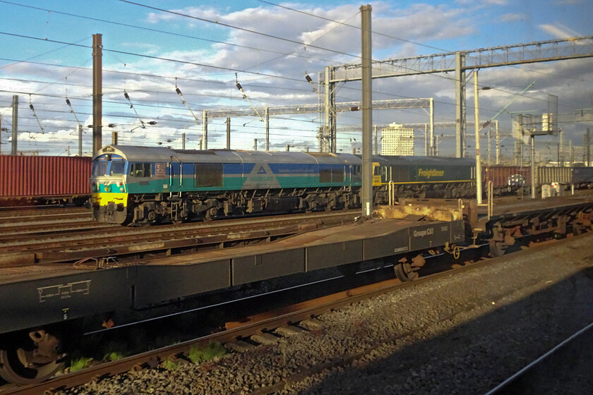 59001 & 66598, Wembley Yard 
 59001 'Yeoman Endeavour' and 66598 sit in Wembely Yard at the head of a stone train. Being a Class 59 means that it will have worked up from the West Country and will be returning there. However, by Tuesday (according to TOPS) the train and locomotives were still at Wembley so I am not sure when it returned. 
 Keywords: 59001 66598 Wembley Yard Yeoman Endeavour