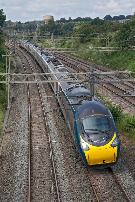 390010, VT 11.47 Liverpool Lime Street-London Euston (1A32, 8E), Victoria bridge 
 390010 'Cumbrian Spirit' sweeps around the reverse curve just south of Roade at Victoria bridge working the Avanti West Coast 11.47 Liverpool Lime Street to Euston 1A32 service. 
 Keywords: 390010 11.47 Liverpool Lime Street-London Euston 1A32 Victoria bridge Cumbrian Spirit