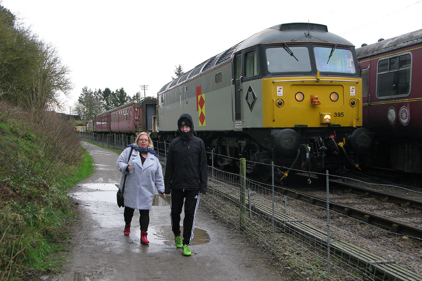 Wife & son, 47205, 13.00 ex. Pitsford & Brampton, Pitsford & Brampton station 
 As 47205 leaves Pitsford and Brampton station on the NLR my lovely wife and son walk along the path beside the railway. The team at the NLR have done a nice job restoring 4205, here seen carrying its other number 47395. It is their only regularly performing diesel. 
 Keywords: 47205 13.00 Pitsford & Brampton station