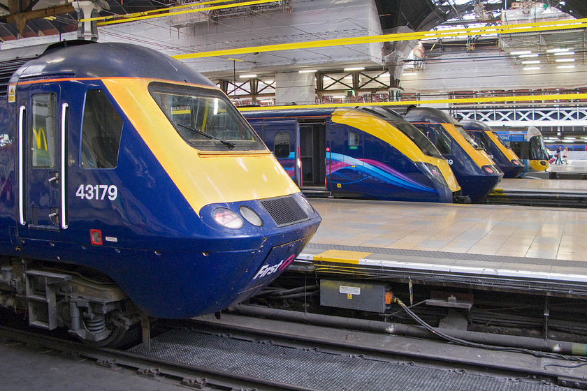 43179 (1U06), 180102 (1W00), 43069 (1C75), class 43 (1G11) & 332001, London Paddington station 
 With much evidence on the continued work to restore Paddington's superb roof and glazing a familiar line-up of trains sits at the blocks. From front to rear.....

43179 'Pride of Laira', 08.30 London Paddington-Bath Spa (1U06)
180102, 08.21 London Paddington-Hereford (1W00)
43069, 08.35 Paddington-Paignton (1C75)
Class 43, 08.15 Paddington-Cheltenham Spa (1G11)
332001, 08.40 Paddington-Heathrow (1Y30) 
 Keywords: 43179 08.30 Paddington-Bath Spa 1U06 180102 08.21 Paddington-Hereford 1W00, 43069 08.35 Paddington-Paignton 1C75 class 43 HST 08.15 Paddington-Cheltenham Spa 1G11 332001 08.40 Paddington-Heathrow 1Y30 First Great Western High-Speed Train Aldante Pride of Laira