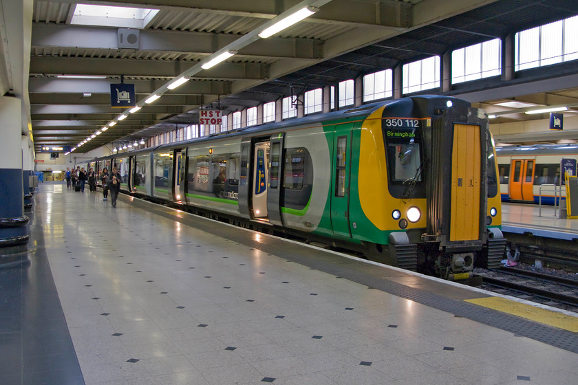 350112, LM 19.46 London Euston-Birmingham New Street (1Y79), London Euston station 
 As it is the end of April at nearly 20.00 there is still plenty of light entering Euston's platforms through the glass. Thus, 350112 is well lit as it stands at platform seven ready to the 19.46 to Birmingham New Street. My wife and I took this train back to Northampton after our busy day out in the capital. 
 Keywords: 350112 19.46 London Euston-Birmingham New Street 1Y79 London Euston station Desiro London Midland Railway