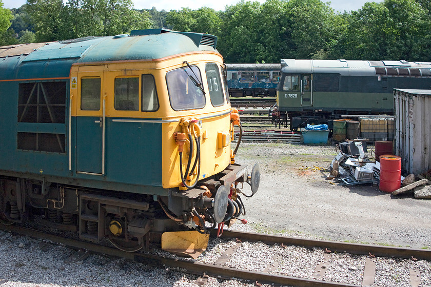 33103 & D7629, stabled, Wirksworth yard 
 33103 'Swordfish' is seen stabled in Wirksworth yard. The Crompton is on-loan to the Ecclesbourne Railway having arrived last year. It has remained in Derbyshire apart from a brief spell on the Dartmoor Railway. It is still mainline certified but not to run under its own power. Behind it is D7629 that usually resides on the GCR (Nottingham) line. It is half way through a year on-loan to the Ecclesbourne Railway mainly being used to haul the afternoon dining trains. 
 Keywords: 33103 D7629 Wirksworth yard