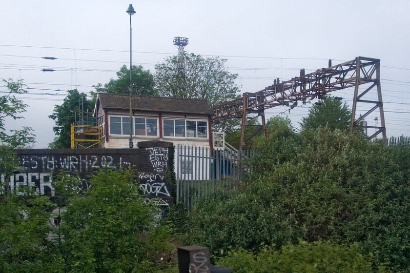 Willesden Carriage South Shed signal box (LMS, c. 1953) 
 Visible from the North Circular A406 I have never managed a photograph of Willesden Carriage South Shed signal box. I managed this rather disappointing record shot from a passing Bakerloo Line rain as we left Stonebridge Park station. The box was constructed to a standard LMS design by the company in 1947 but not actually opened until 1953 by which time the LMS had been subsumed into British Railways. 
 Keywords: Willesden Carriage South Shed signal box LMS