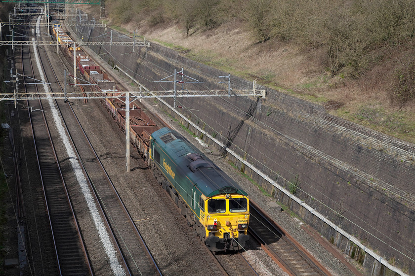 66531 & 66551, 09.36 Camden South Junction-Crewe Basford Hall (6Y58), Roade Cutting 
 66531 brings up the rear of the 09.36 Camden South Junction to Crewe Basford Hall engineer's train. 66551 is leading the train that is making its way slowly through Roade Cutting. 
 Keywords: 66531 66551 09.36 Camden South Junction-Crewe Basford Hall 6Y58 Roade Cutting