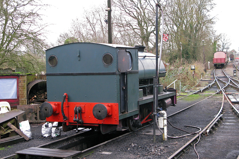 2104, stabled, Pitsford yard 
 Undergoing repairs and boiler work the NLR's Peckett 0-4-0 waits in the sidings at Pitsford station with its 'Not to be Moved' sign. This particular Peckett is a cut down version built at their Bristol factory in 1948 fro use in Croydon per station. It moved to the NBLR in the very earliest years of its operation in 1989 and has been there ever since. 
 Keywords: 2104 Pitsford yard