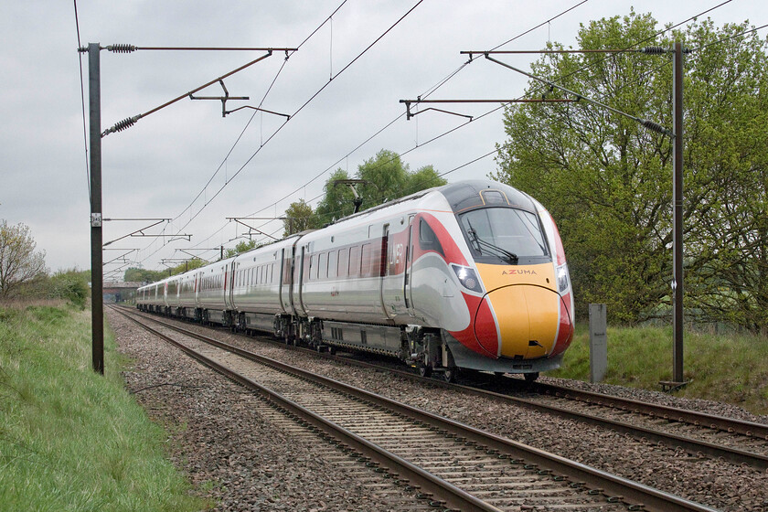 801104 & 801106, GR 10.15 Leeds-London King's Cross (1A22, 3E), Penny's crossing SK630970 
 801104 and 804106 pick up speed south of Doncaster working the 1A22 10.15 Leeds to King's Cross LNER service. The photograph is taken from Penny's foot crossing near Great Rossington, a popular and busy crossing for dog walkers and the like judging by the numbers using it during our visit. 
 Keywords: 801104 801106 10.15 Leeds-London King's Cross 1A22 Penny's crossing SK630970 LNER Azuma