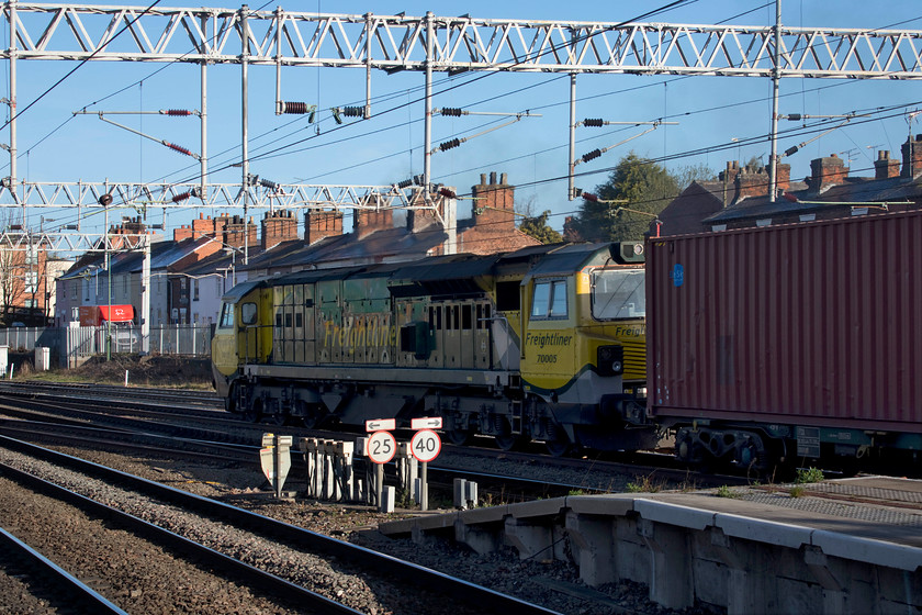 70005, 03.18 Southampton-Trafford Park (4M95), Stafford station 
 A pretty poor picture of 70005 but, to date, this is the only one I have of this particular locomotive. As it accelerated through Stafford station, it was smoking badly from its exhausts, even though this picture does not show it very clearly, cloaking the station under a grey cloud. The 70 was leading the heavily loaded 03.18 Southampton to Trafford Park Freightliner. 
 Keywords: 70005 03.18 Southampton-Trafford Park 4M95 Stafford station