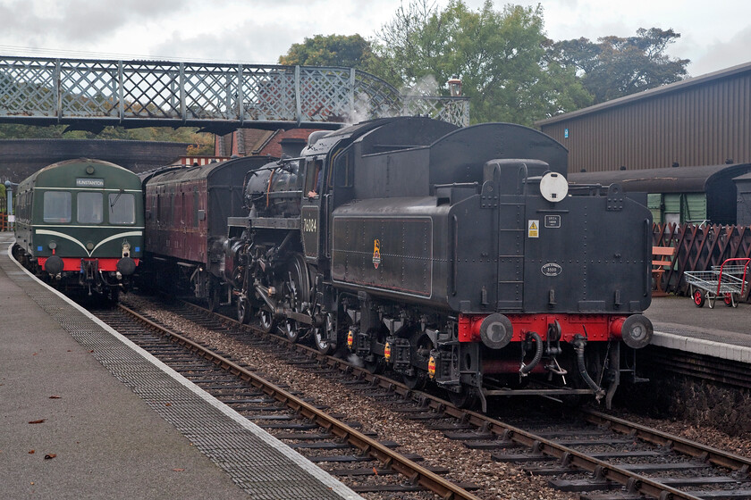 E56062 & E51228, 10.35 Sheringham-Holt & 76184, 10.40 Holt-Sheringham, Weybourne station 
 Service operations on the North Norfolk Railway use Weybourne as a passing point as it is roughly equidistant between Sheringham and Holt. When things go to plan this all works well as is the case here on Monday 17th October 2022. To the left, one of the line's Class 101 DMUs (E56062 and E51228) waits to head to Holt with the 10.35 departure from Sheringham whilst 4MT 76184 arrives tender first with the 10.40 from Holt. 
 Keywords: E56062 E51228 10.35 Sheringham-Holt 76184 10.40 Holt-Sheringham Weybourne station Class 101 first generation DMU Standard 4MT