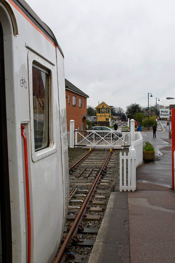 156418, LE 09.46 Sheringham-Norwich, Sheringham station 
 The view from the end of Sheringham's Network Rail station looking over the appropriately named Station Road towards the current limit of the North Norfolk Railway. The level crossing was reinstated four years ago with great fanfare and sees occasional use being limited to twelve times per year. 
 Keywords: 156418 09.46 Sheringham-Norwich Sheringham station Greater Anglia