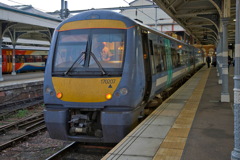 170207, LE 16.45 Norwich-Sheringham (2S26), Norwich station 
 Our train home from Norwich to Sheringham waits to leave running as the 2S26 16.45 departure. With my wife and son already aboard 170207, I nipped to the front of the train to get this photograph just five minutes before departure. 
 Keywords: 170207 16.45 Norwich-Sheringham 2S26 Norwich station