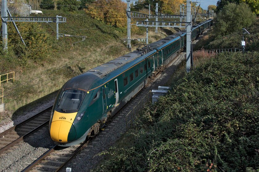 800312, GW 14.02 London Paddington-Paignton (1C17, 2L), Baulking 
 A scene at Baulking between Didcot and Swindon that the installation of the electrification has not absolutely ruined for the railway photographer. Even back in 2015 the location was tricky due to the signal gantry just in front of the overbridge, see... https://www.ontheupfast.com/p/21936chg/27837770204/class-43-14-00-london-paddington . 800312 heads westwards working the 1C17 14.02 Paddington to Paignton service that travels via the GWML rather than the more usual Berks. and Hants. route. 
 Keywords: 800312 14.02 London Paddington-Paignton 1C17 Baulking GWR IET