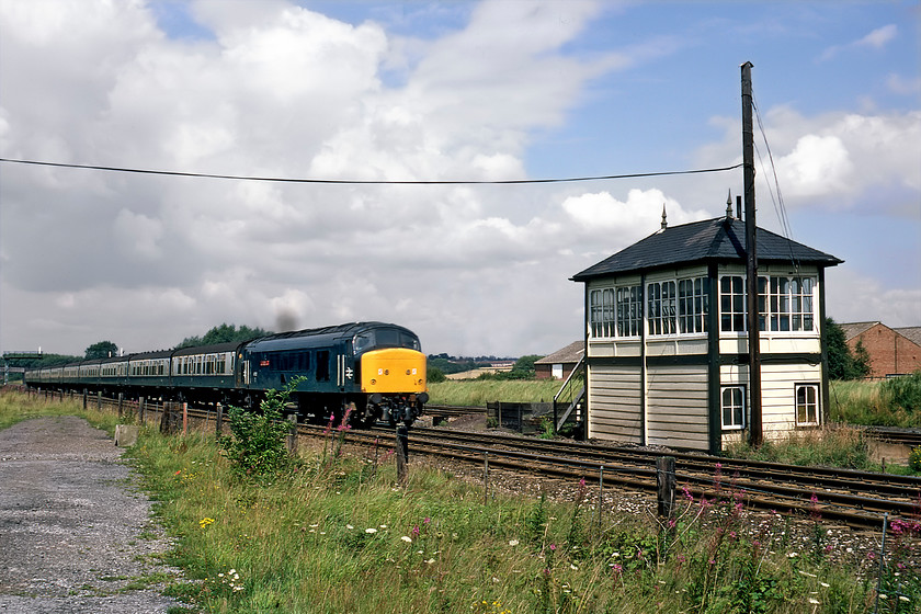 45112, 12.07 Derby-London St. Pancras (1C49) & Finedon station signal box (Mid, date not known) 
 Seen yesterday evening passing Wellingborough and now seen again slightly further north 45112 'Royal Army Ordnance Corps' heads south with the 1C49 12.07 Derby to St. Pancras service. It is about to pass the delightful Finedon Station signal box a Midland structure that I do not have an exact date for but it will have originated from sometime around 1890. As the name of the box suggests, there was once a station at this location that closed very early on in 1940. Its premature closure was probably due to it being located nearly two and a half miles from the village that it purported to serve! 
 Keywords: 45112 12.07 Derby-London St. Pancras & Finedon station signal box Peak Midland Railway Royal Army Ordnance Corps