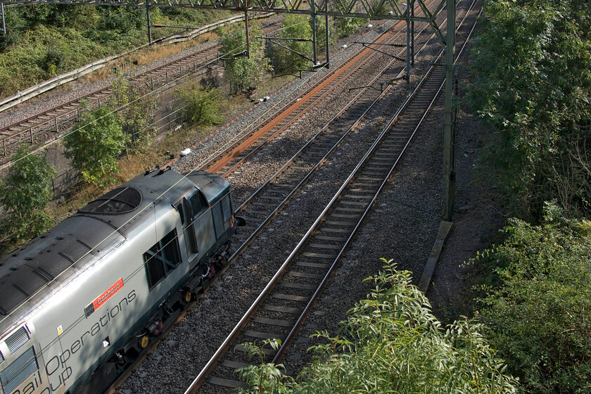 37884, 12.07 Derby RTC-Wembley HS (0H72, 14E), Blue bridge 
 I had set up and planned this unusual reverse photograph of the 0H72 12.07 Derby to Wembley light engine move and sat and waited for it for half an hour. However, as can be seen, despite all my planning, it did not work as I had failed to notice that the camera's memory card was full. I managed two 'burst' photographs before the shutter stopped firing with a bleep from the camera! I have included the image of 37884 'Cepheus' as a reminder to always check all the camera's settings prior to pressing the shutter; all others out there to take note too! 
 Keywords: 37884 12.07 Derby RTC-Wembley HS 0H72 Blue bridge ROG Rail Operations Group Cepheus