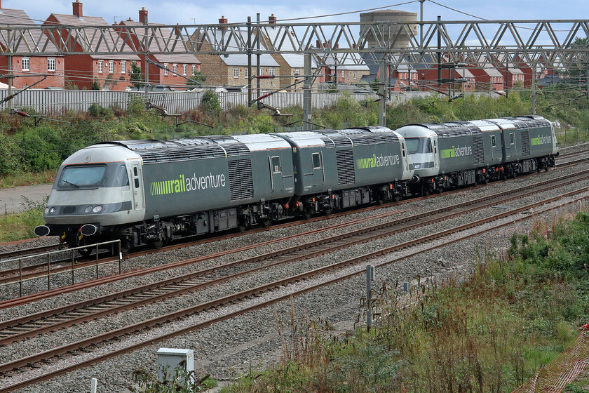 43465, 43484, 43480 & 43468, 12.03 Wembley Reception-Butterley M.R.C (0Z43, 82E), site of Roade station 
 Having worked up earlier in the morning delivering some barrier vehicles to Wembley Yard former Grand Central (and East Coast) HST power cars 43465, 43484, 43480 and 43468 return as the 12.03 to Butterley (Midland Railway Centre). Railadventure have cornered the market when it comes to the movement of stock around the network with the former HST power cars appearing to be well suited to the job. 
 Keywords: 43465 43484 43480 43468 12.03 Wembley Reception-Butterley M.R.C 0Z43 site of Roade station Raiadventure HST