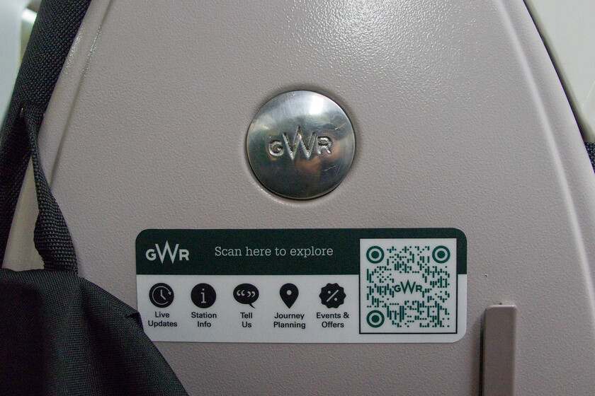 Interior fittings, 14.00 Cardiff Central-Penzance (2C79, 30L), Bristol Temple Meads station 
 The Class 255 short-set HSTs (dubbed the Castle sets) were introduced by GWR in 2018/19 enabling the second generation DMUs to be withdrawn and/or moved on from the Cardiff-Bristol-Penzance route. The sets were completely rebuilt from the former Mk.III coaches by Wabtec at Doncaster and what a superb job they did. The interiors are quiet, comfortable and well appointed belighing the fact that the basic structure is nearly fifty years old! There are some nice touches such as the proper metal GWR roundel applied to the seat back seen here. I also scanned the QR code seen and it took me straight to a cut-down version of GWR's website hosted by whoosh.media. I used this site to post a positive comment about the guard of our train who gave out excellent and concise information over the train information system regarding our slightly delayed departure form Temple Meads. 
 Keywords: Interior fittings, 14.00 Cardiff Central-Penzance (2C79, 30L), Bristol Temple Meads station Castle Class HST