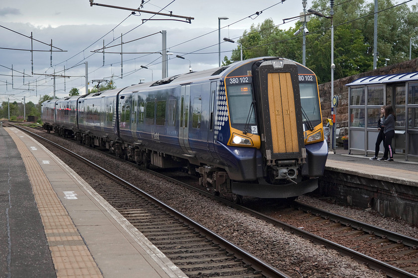 380102, SR 12.37 Ayr-Edinburgh Waverley (1C58, 3L), Wishaw station 
 380102 arrives at Wishaw station that is southwest of Glasgow with the 12.37 Ayr to Edinburgh Waverley. Having had a poor start, these class 380 units have been in squadron service for some eight years and are the backbone of many ScotRail services. 
 Keywords: 380102 12.37 Ayr-Edinburgh Waverley 1C58 Wishaw station