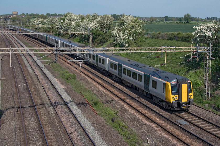 350104, 350253 & 350249, LN 11.45 Northampton-London Euston (2N34, 1E), Victoria bridge 
 Irritatingly, the sun is not round quite far enough to illuminate the sides of the 11.45 Northampton to Euston London NorthWestern service at Victoria bridge near Roade being led by 350104. Given a choice, I would probably prefer to have my regular photographic haunt on an east-west route such as the GWML rather than one that is ostensibly north-south. However, this is where I live now so I have to make the best of it and pick my locations with great care. 
 Keywords: 350104 350253 350249 11.45 Northampton-London Euston 2N34 Victoria bridge London NorthWestern Desiro