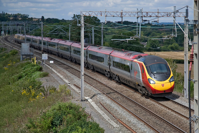 390130, VT 10.20 Manchester Piccadilly-London Euston (1A11), Blisworth 
 The reverse curves at Blisworth show display the tilting capabilities of 390130 'City of Edinburgh' as it speeds south with the 10.20 Manchester Piccadilly to Euston Virgin service. 
 Keywords: 390130 10.20 Manchester Piccadilly-London Euston 1A11 Blisworth Virgin West Coast Pendolino City of Edinburgh