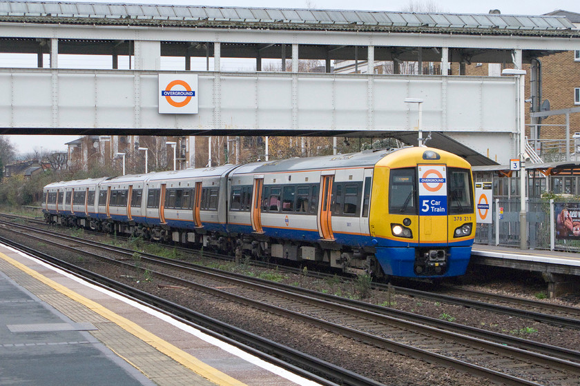 378211, LO 12.11 Willesden Junction-Clapham Junction (2Y51), Kensington Olympia station 
 London Overground's Capitalstars operate all across North London. This particular one has started at Willesden Junction making the relatively short journey to Clapham Junction running as 2Y51. It is seen waiting for the right away at Kensington Olympia station. 
 Keywords: 378211 12.11 Willesden Junction-Clapham Junction 2Y51 Kensington Olympia station capitalstar London Overground