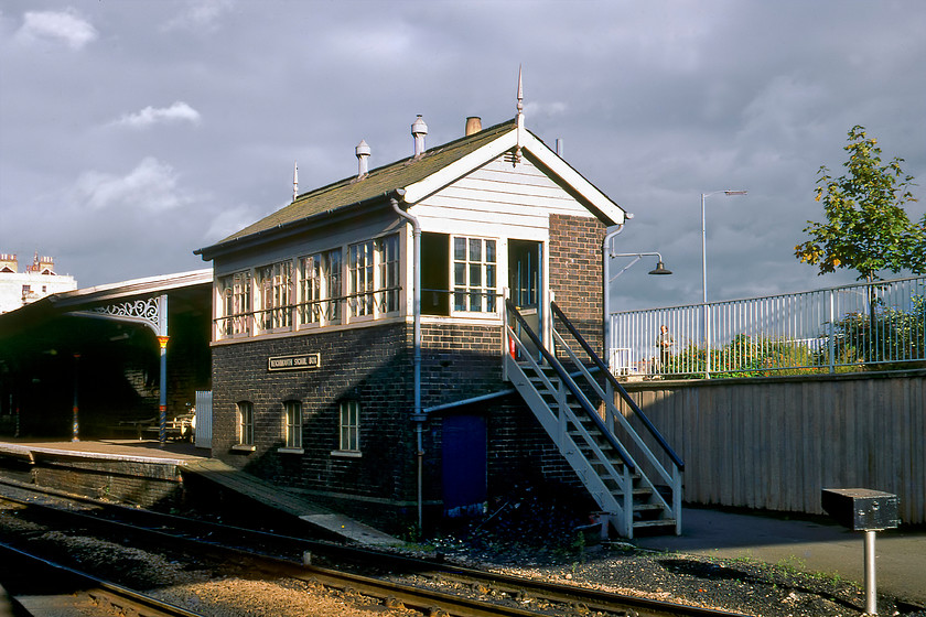 Teignmouth signal box (GW, 1896) 
 Teignmouth signal box catches the early evening sunshine located at the western end of the down platform. The 1896 GWR box retains many of its original features in this photograph taken some six years prior to its closure. 
 Keywords: Teignmouth signal box GWR Great Western Railway