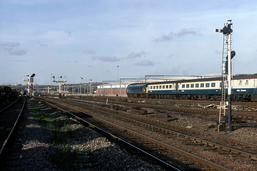 45114, 13.01 London St. Pancras-Sheffield (1E40), Brent Yard 
 I am not quite sure why I took a going away shot of the 13.01 St. Pancras to Sheffield, being led by 45114, as I had just taken a decent shot of it approaching? However, this is a nice photograph that gives a really clear idea of the size of Brent Yard complete with quite a number of semaphores. Much of the land to the left that contained many sidings has now been sold off and is the home to Geron Way, with a number of leisure and retail outlets built on the land. 
 Keywords: 45114 13.01 London St. Pancras-Sheffield 1E40 Brent Yard