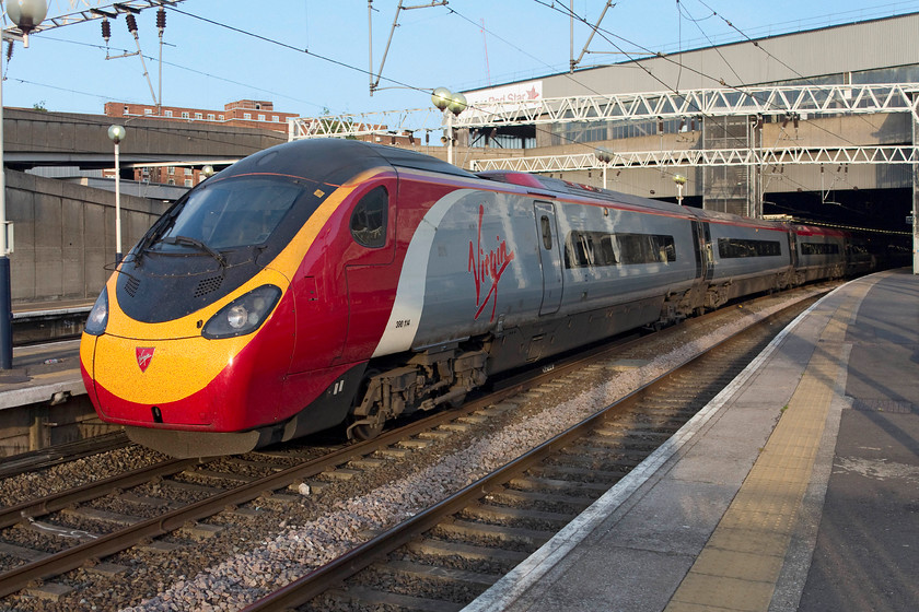 390114, VT 19.30 London Euston-Glasgow C (1S06, 5L), London Euston station 
 Under a lovely spring evening sky 390114 'City of Manchester' waits to leave Euston with the 1S06 19.30 to Glasgow Central. This is the last train of the day to leave for Glasgow where it arrives at just after midnight. On this occasion, this train arrived at 00.10 just five minutes late after completing its 400 mile journey. 
 Keywords: 390114 1S06 London Euston station