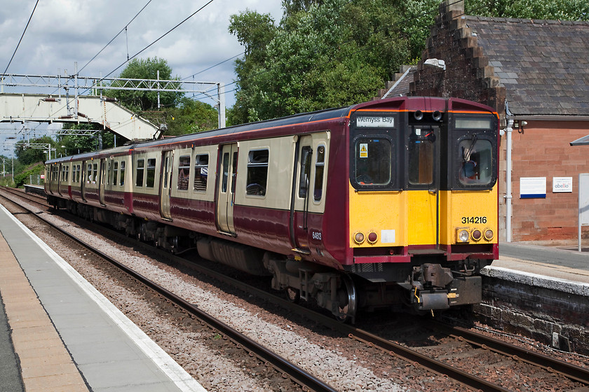 314216, SR 11.57 Wemyss Bay-Glasgow Central (1W30, RT), Bishopton station 
 Looking very smart in its carmine and cream livery 314216 waits at Bishopton station working the 11.57 Wemyss Bay to Glasgow central train. Bishopton station was opened in 1841 and sits on the Inverclyde line just northwest of Paisley. 
 Keywords: 314216 1W30 Bishopton station