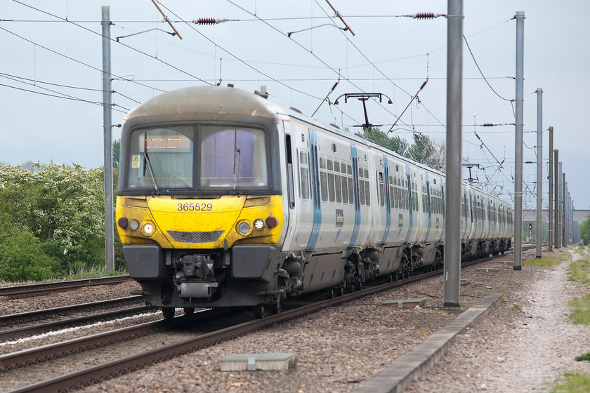 365529 & 365541, GN, 12.46 Peterborough-London Kings Cross (1P63, 1E), White House Crossing TL227777 
 365529 and 365541 head south forming the 12.46 Peterborough to King's Cross stopper. It is seen working as fast as it dare on the up fast past White House Crossing north of Huntingdon. This section of track is a bottle neck on this section of the ECML where all up services are forced on to one line at Fletton Junction south of Peterborough. This is a situation that Network rail want to change by reinstating the up slow that was removed by BR in the 1970s. 
 Keywords: 365529 365541 1P63 White House Crossing TL227777